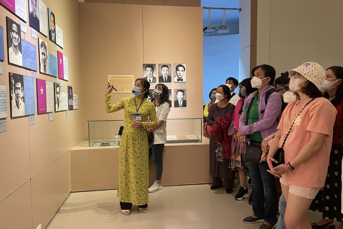 Visitors quietly touring the solemn exhibition halls of Con Dao Museum